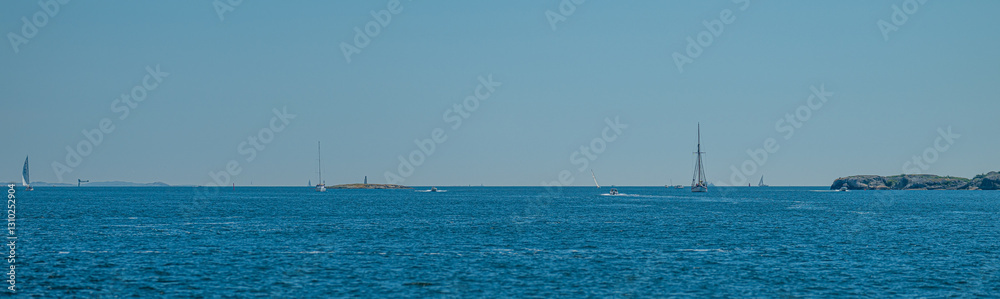 blue ocean with sailboats in the distance. blue ocean with sailboats in the distance.