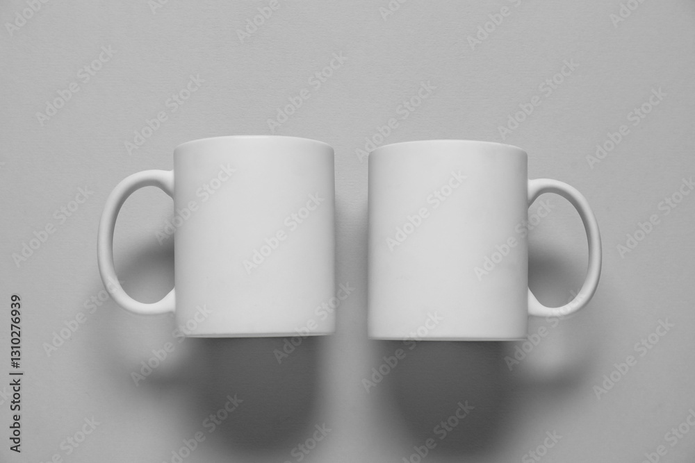 Blank cups for branding on gray background, flat lay. Mockup for design Blank cups for branding on gray background, flat lay. Mockup for design