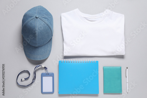 Different blank items for branding on grey background, flat lay. Mockup for design