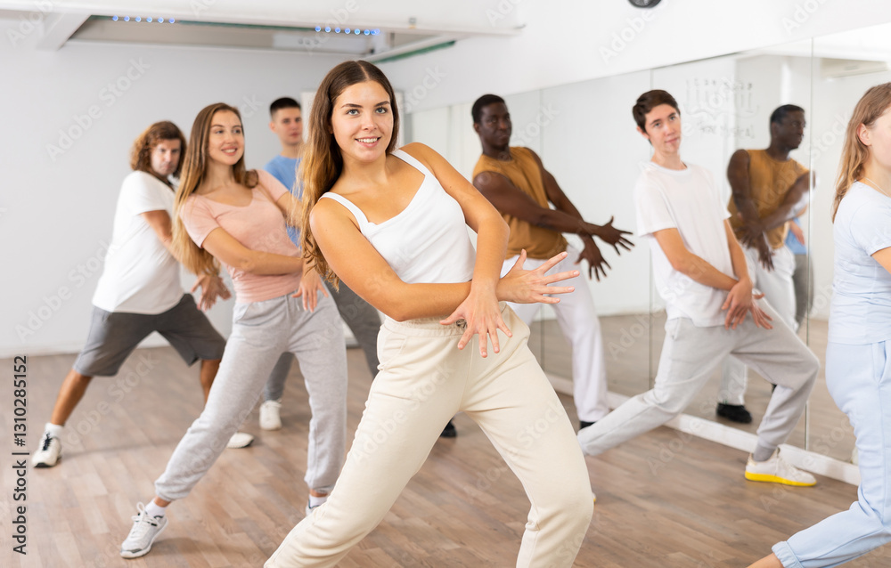 Naklejka premium Dance class for adult people, positive women and men training in studio