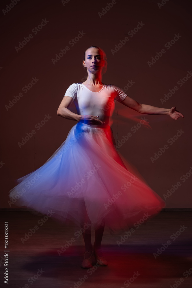 Obraz premium Caucasian woman dancing classical dance in tutu . Long exposure photo. 
