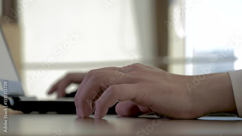 Businessman hands are tapping hesitantly on desktop. Employee types with fingers on laptop keyboard, moment in professional corporate workspace. Hand gesture reflects thoughtfulness of expectation