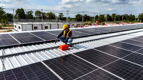 Wallpaper Mural Workers installing and inspecting solar panels on a rooftop in a sunny environment, highlighting renewable energy, sustainability, and efficient use of modern technology in solar power systems. Torontodigital.ca