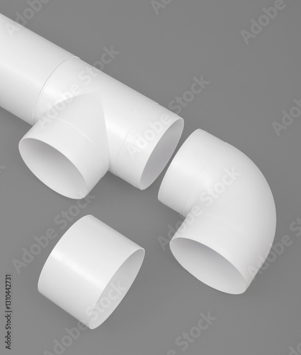 White round plastic pipe on a gray background. Ventilation system.
