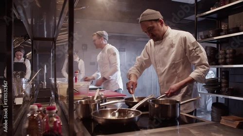 Team working together in kitchen of restaurant