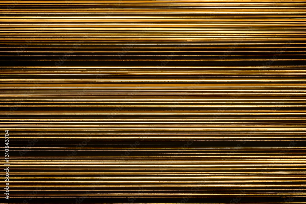 Obraz premium Shiny Gold Horizontal Lines in an Abstract Decorative Background Pattern