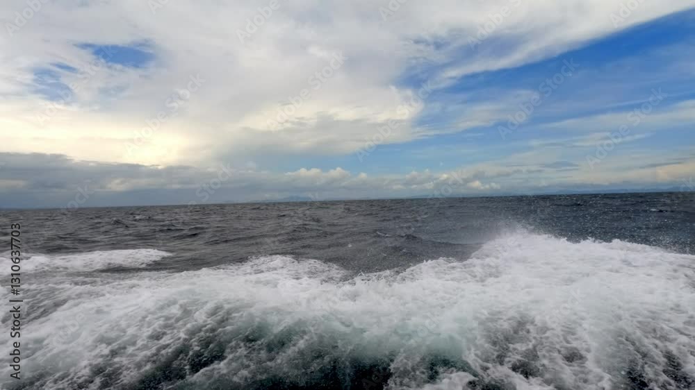 Vast ocean with waves crashing under a breezy, partly cloudy sky, revealing natures everchanging beauty and majesty. Blue Sea power and feelings of freedom, and natures beauty Slow motion 4k Vast ocean with waves crashing under a breezy, partly cloudy sky, revealing natures everchanging beauty and majesty. Blue Sea power and feelings of freedom, and natures beauty Slow motion 4k
