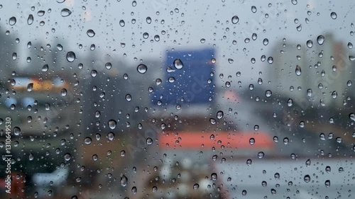 Rainwater flows on the window glass