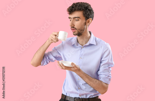 Young businessman with cup ...