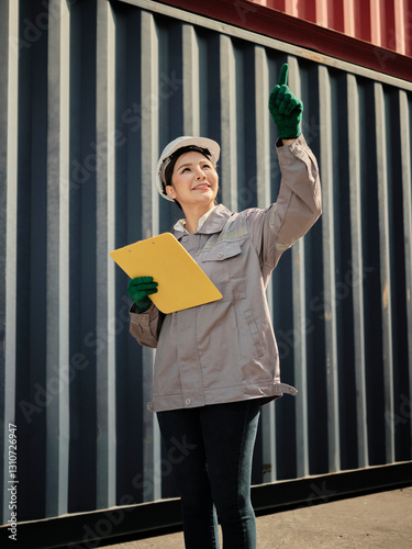Portrait of asian woman worker holding clipboard and pointing