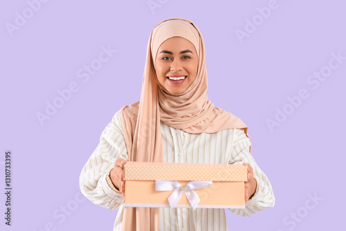 Muslim woman with gift box ...