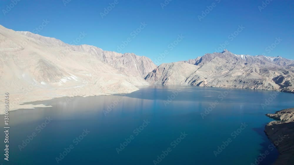 Drone view of Bulungkol or Bandier blue Lake on sunny day in Tashkurgan County, Kashgar, Southern Xinjiang, China. Aerial landscape of landmark on Pamir plateau, 4k real time footage, travel concept. Drone view of Bulungkol or Bandier blue Lake on sunny day in Tashkurgan County, Kashgar, Southern Xinjiang, China. Aerial landscape of landmark on Pamir plateau, 4k real time footage, travel concept.