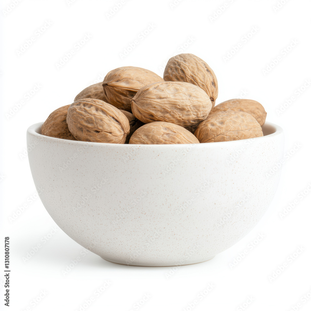 Whole walnuts in white ceramic bowl on white background Whole walnuts in white ceramic bowl on white background