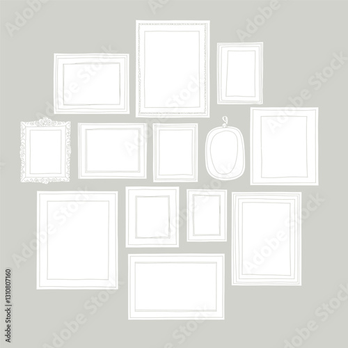 Variety of White Picture Frames on Gray Wall