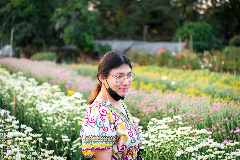 Woman (LGBTQ) posing at flower park garden field Woman (LGBTQ) posing at flower park garden field