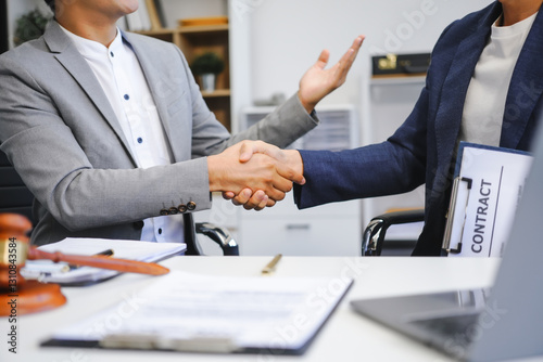 A businessman and a male lawyer or a team of judges discuss a joint investment meeting. They provide legal advice, review contracts, and ensure compliance with business laws and regulations