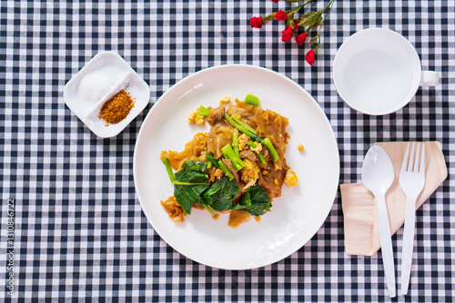 Stir fried soy sause noodles with pork photo