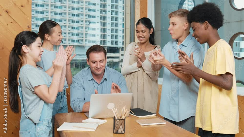 Skilled teacher clapping hand to encourage student to do project or celebrating successful project. Diverse children clap hands together while standing surround professional instructor. Edification Skilled teacher clapping hand to encourage student to do project or celebrating successful project. Diverse children clap hands together while standing surround professional instructor. Edification