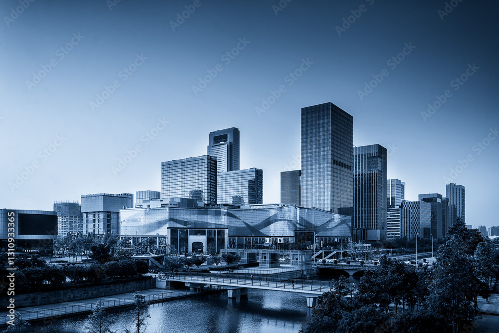 Obraz premium Modern Urban Skyline at Dusk Captured in Blue Tones