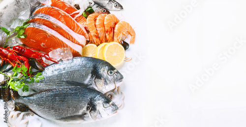 Various types of fresh, clean seafood for cooking Covered with ice, placed on a white background.