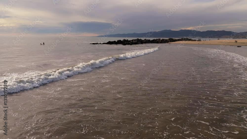 Slow Motion Waves Rolling onto a Serene Beach Slow Motion Waves Rolling onto a Serene Beach