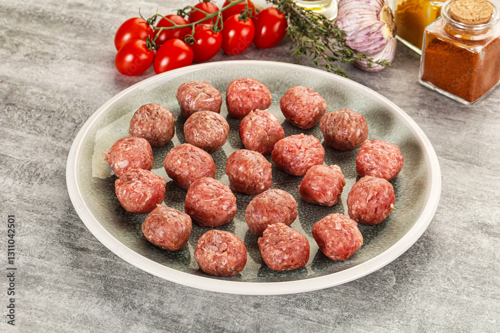 Uncooked raw beef meatball minced Uncooked raw beef meatball minced