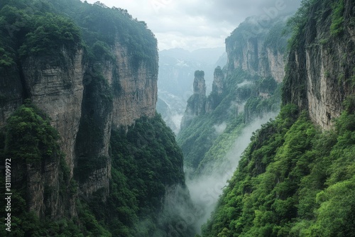 A deep mountain canyon with lush greenery, towering cliffs and rugged terrain.
