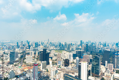 Bangkok, Thailand - Febuary 2, 2025: BTS Chong Nonsi interchange skywalk, Sky Transit, Urban view with dusk air
