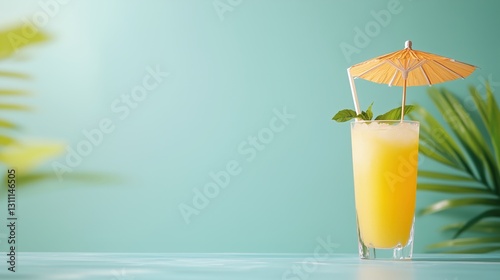 A tropical cocktail with a straw and umbrella on a beachside table, space for text