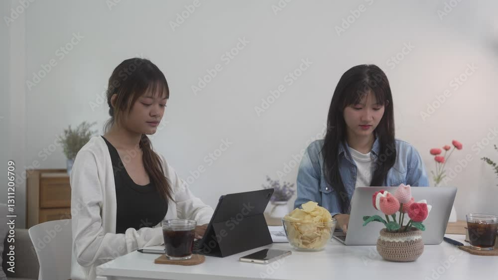 Students studying and brainstorming campus concept. Close up of students discussing their subject on books textbooks and writing to notebook. Students studying and brainstorming campus concept. Close up of students discussing their subject on books textbooks and writing to notebook.