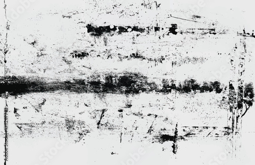 Distressed black and white grunge texture with scratches and splatters, ideal for overlays and backgrounds.