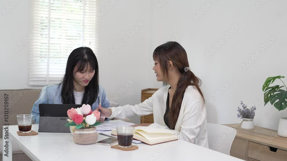 Students studying and brainstorming campus concept. Close up of students discussing their subject on books textbooks and writing to notebook. Students studying and brainstorming campus concept. Close up of students discussing their subject on books textbooks and writing to notebook.