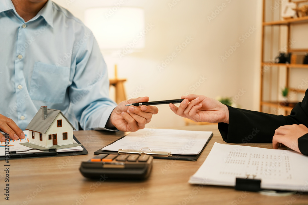 Fototapeta premium Businesswoman embraces client after successful property negotiation.