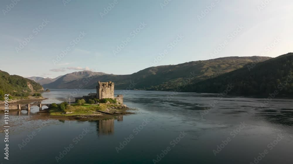 Forward ascending drone shot past Eilean Donon castle on clear summers day Forward ascending drone shot past Eilean Donon castle on clear summers day