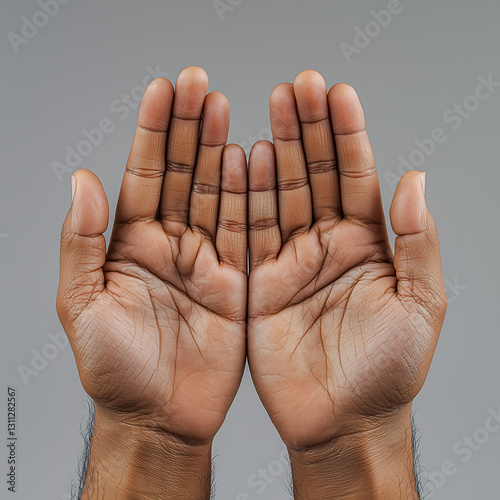 A pair of open hands with palms facing each other, showcasing skin texture and unique hand shapes against a neutral background.