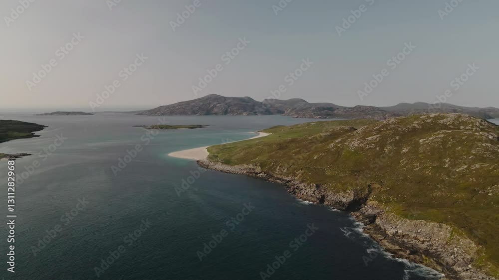 Aerial view of small beach in Outer Hebrides featuring sea and hills in background Aerial view of small beach in Outer Hebrides featuring sea and hills in background