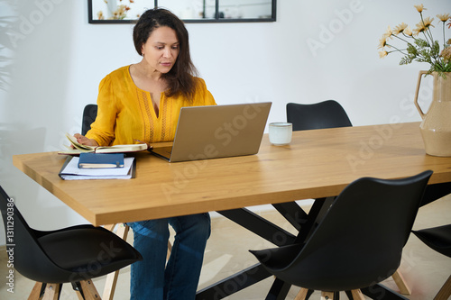 Confident Businesswoman Working Remotely in a Stylish Home Office Setting
