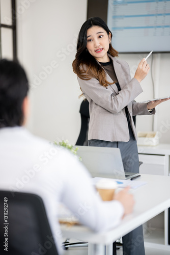 The sales team is having a marketing planning meeting in the conference room.