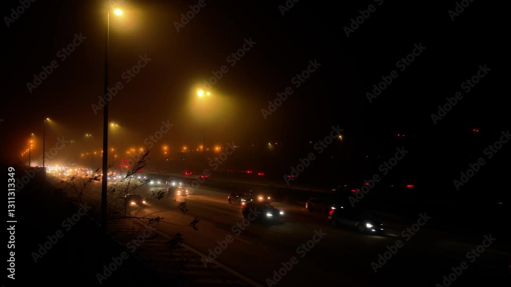 Misty traffic, cars at night of freeway, highway with mist and halation Misty traffic, cars at night of freeway, highway with mist and halation