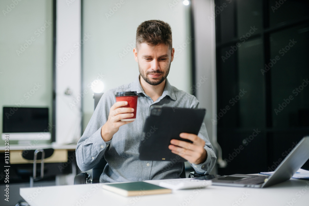 Professional businessman working at office with laptop, tablet, and notes. Perfect for business, finance, accounting Professional businessman working at office with laptop, tablet, and notes. Perfect for business, finance, accounting