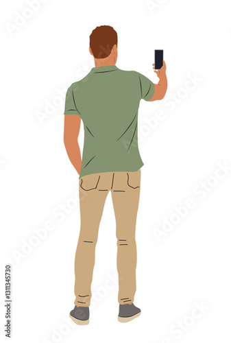 A man in a green shirt and tan pants is taking a picture with his cell phone. Concept of casualness and leisure, as the man is simply enjoying a moment and capturing it with his phone
