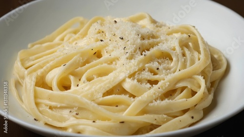 Obraz na płótnie A plate of creamy fettuccine Alfredo topped with parmesan cheese w salonie