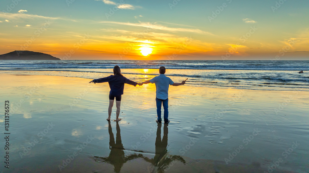 Silhouette of a Couple love toghether on beach at sunset, Vietnam