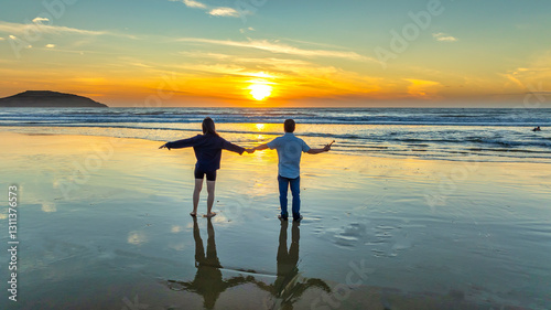 Silhouette of a Couple love toghether on beach at sunset, Vietnam