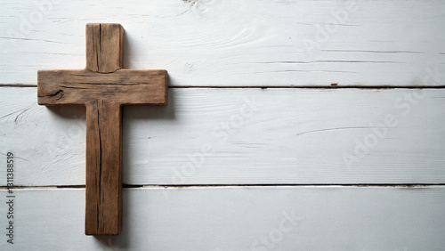 Elegant Christian Cross on Rustic White Wood Background for Religious Publications and Easter Promotions photo