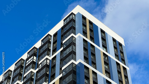 The facade of the building is purple,geometric patterns from windows and balconies, the colored wall of a modern multi-storey residential building, the abstract texture of the facade of the house