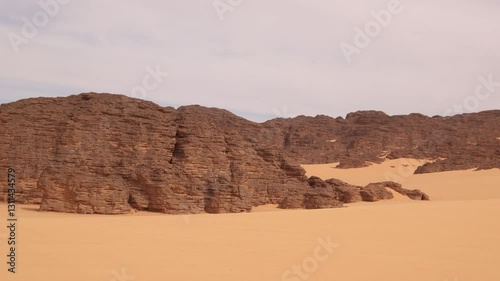 Sahara Desert Algeria unesco heritage sandstone pinnacles, tabular mountains and colossal dunes of polychromatic sand panorami view north african landscape