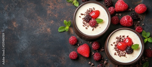 Wallpaper Mural Decadent dessert featuring creamy chocolate fruit butter topped with fresh strawberries raspberries and blackberries in brown bowls on dark textured background Torontodigital.ca