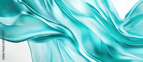 Transparent flowing turquoise silk fabric elegantly draped across a bright white background creating soft curves and gentle waves throughout the image.