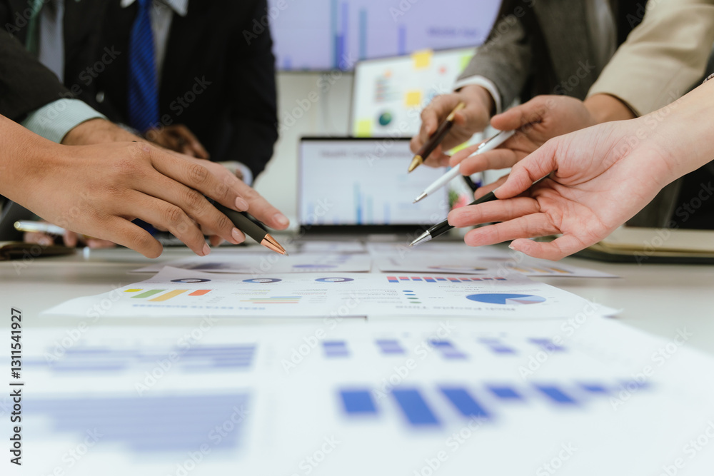 A team of professionals work together in an office to analyze financial charts, market strategies and work as a team to drive business growth and success. A team of professionals work together in an office to analyze financial charts, market strategies and work as a team to drive business growth and success.